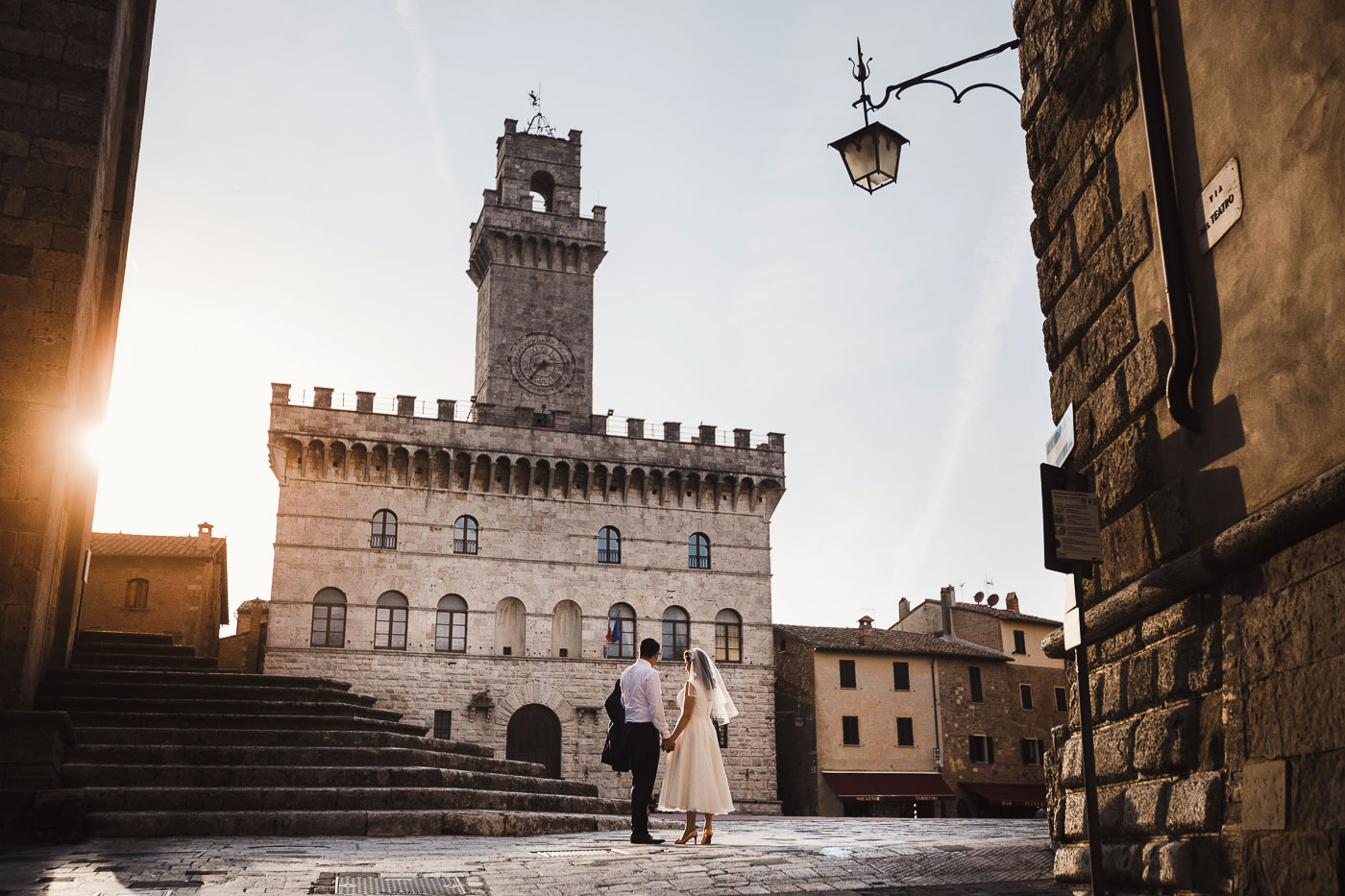 Italy Wedding Packages Cost All Inclusive, a wedding couple in a typical piazza in Italy