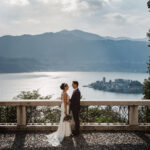 bride and groom with an amazing view of lake orta