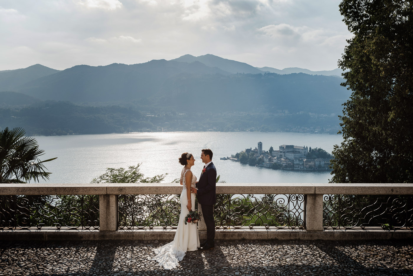 bride and groom with an amazing view of lake orta