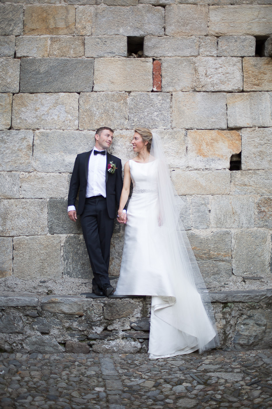 Bride and groom relax in orta San Giulio island