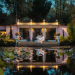 Elopement in Piedmont, amazing view of the bride and her wedding dress by the lake of La Foleia luxury relais