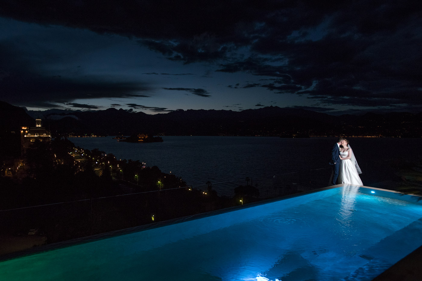 Lake Maggiore wedding photographer, bride and groom on the terrace and the amazing lake Maggiore at the sunset