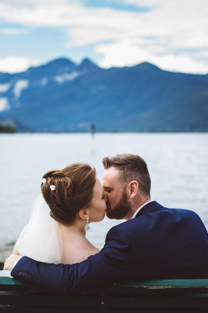 Lake Maggiore wedding photographer, bride and groom kiss with Lake Maggiore as a background